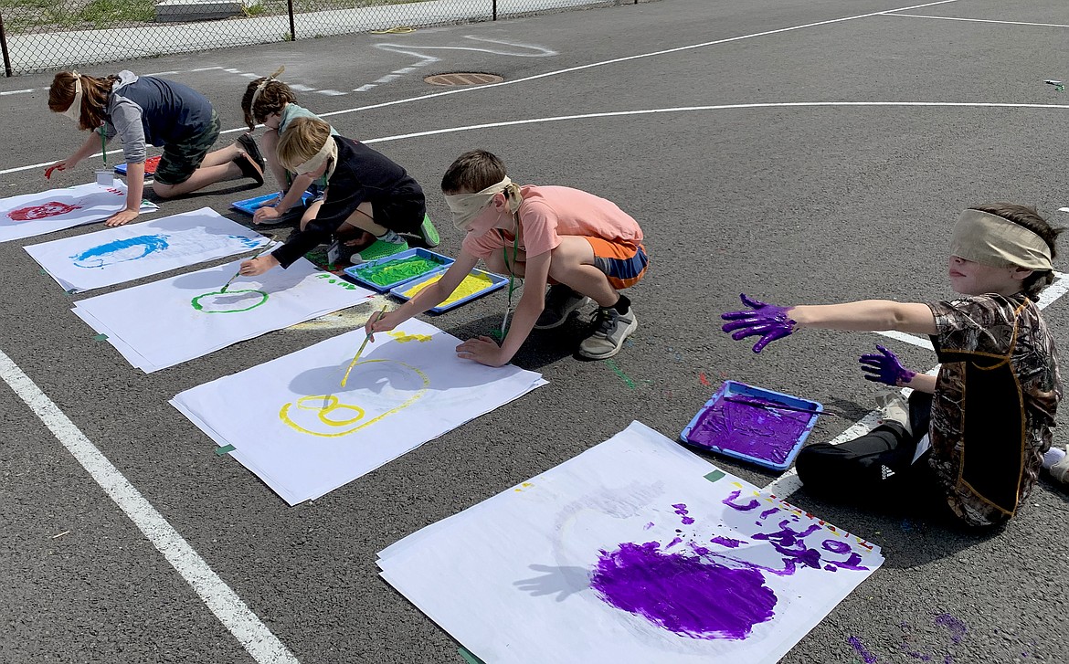 A group of students participate in a sensory activity during the Whitefish Summer Learning Program in July at Muldown Elementary School. (Courtesy photo)