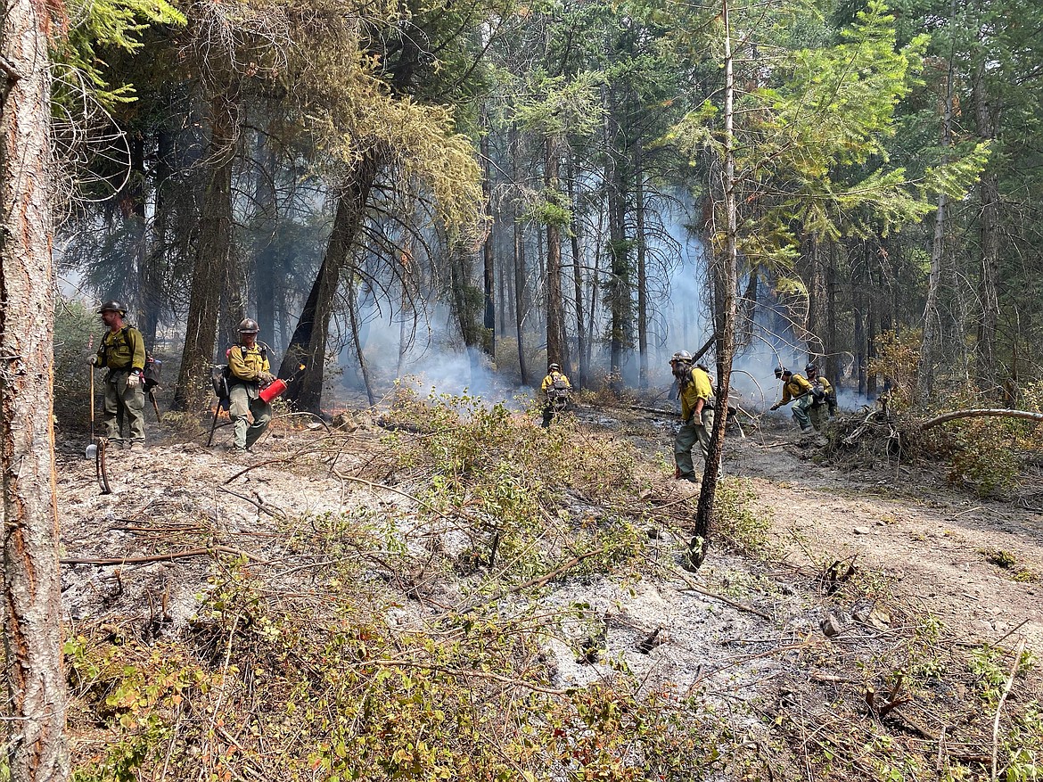 Firefighters work on the perimeter of the Boulder 2700 Fire east of Polson on Monday, Aug. 2, 2021. (Inciweb photo)