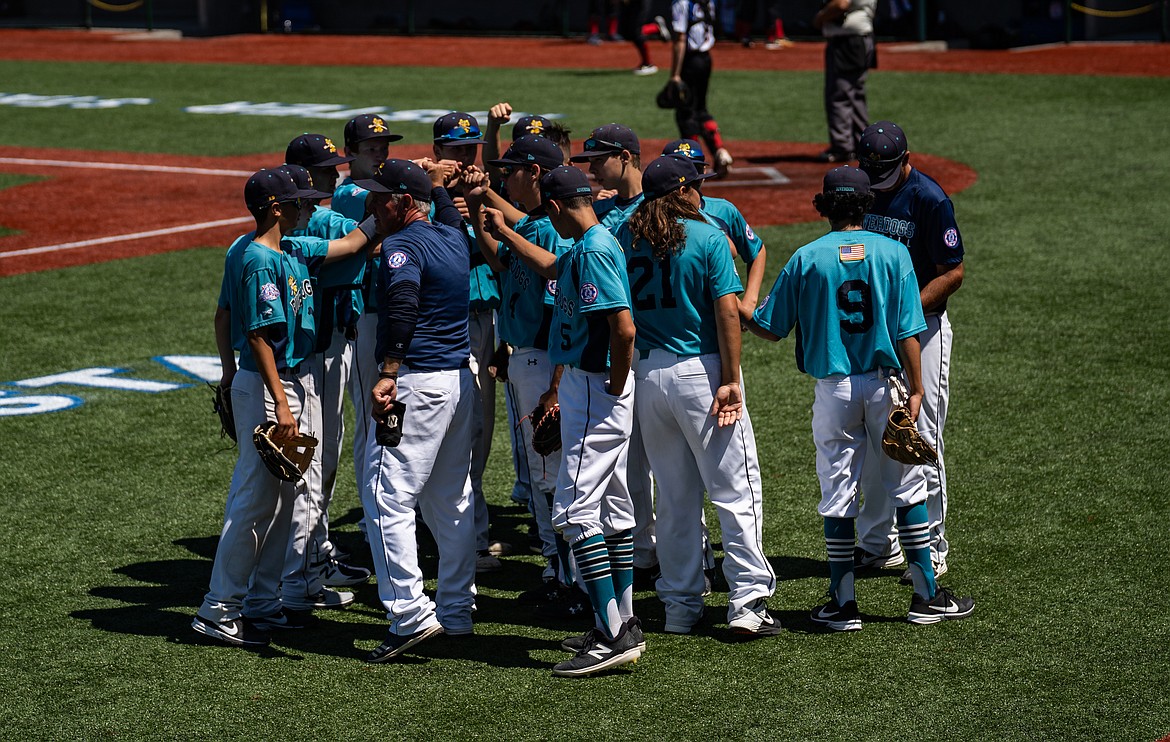 The Columbia Basin Riverdogs 15U team gathers together as a group at the  Pacific Northwest 13-15 Babe Ruth Regional Tournament last week in Kelso, Washington.