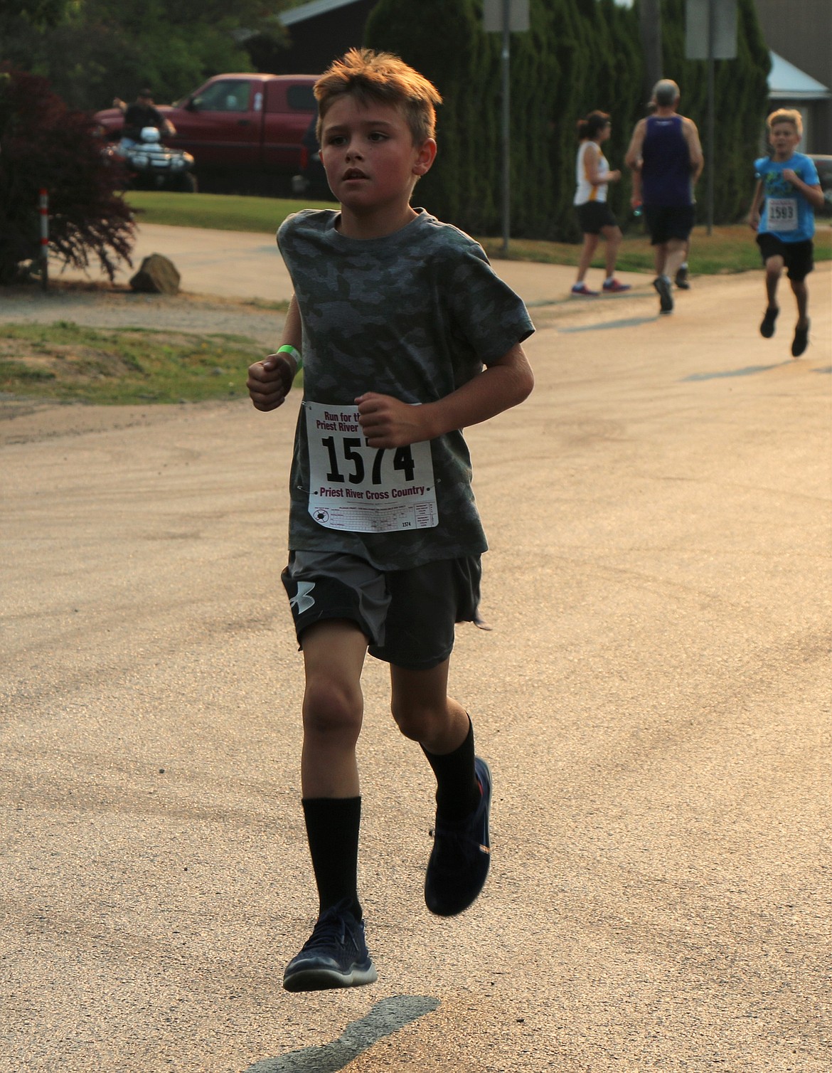 8-year-old Knaak Hudson runs the mile during Saturday's Run for the Berries.