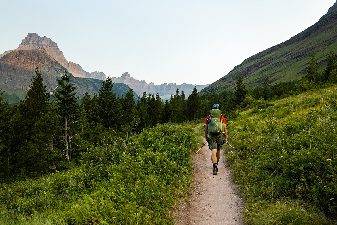 Greg Burfeind walks up a trail toward Ptarmigan Pass on the way to Mount Merritt in Glacier National Park after a rejuvenating night's sleep at the Many Glacier Hotel. (Courtesy of Noah Couser)