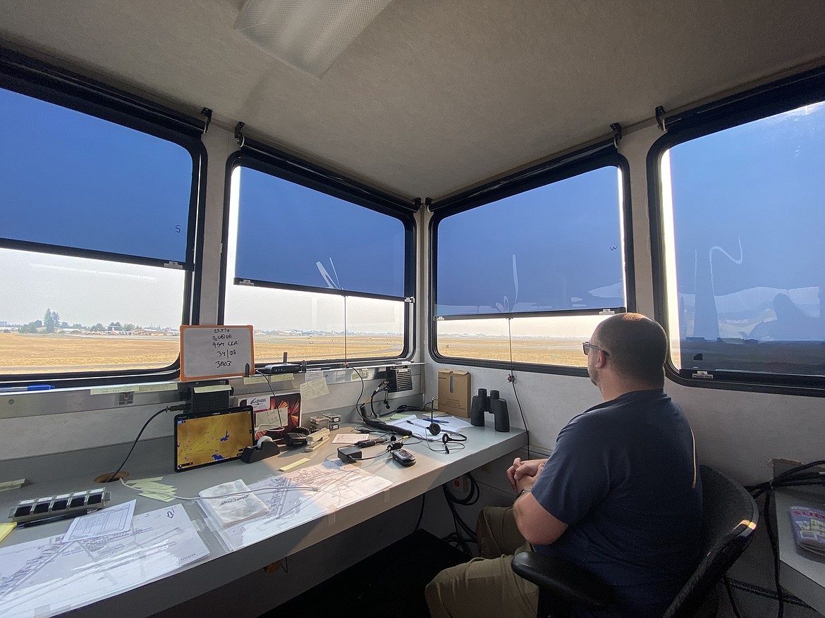 Inside the small temporary trailer used as an air traffic control tower for the Coeur d'Alene Airport are three Federal Aviation Administration employees who have regulated flight operations at the facility since July 10. (MADISON HARDY/Press)