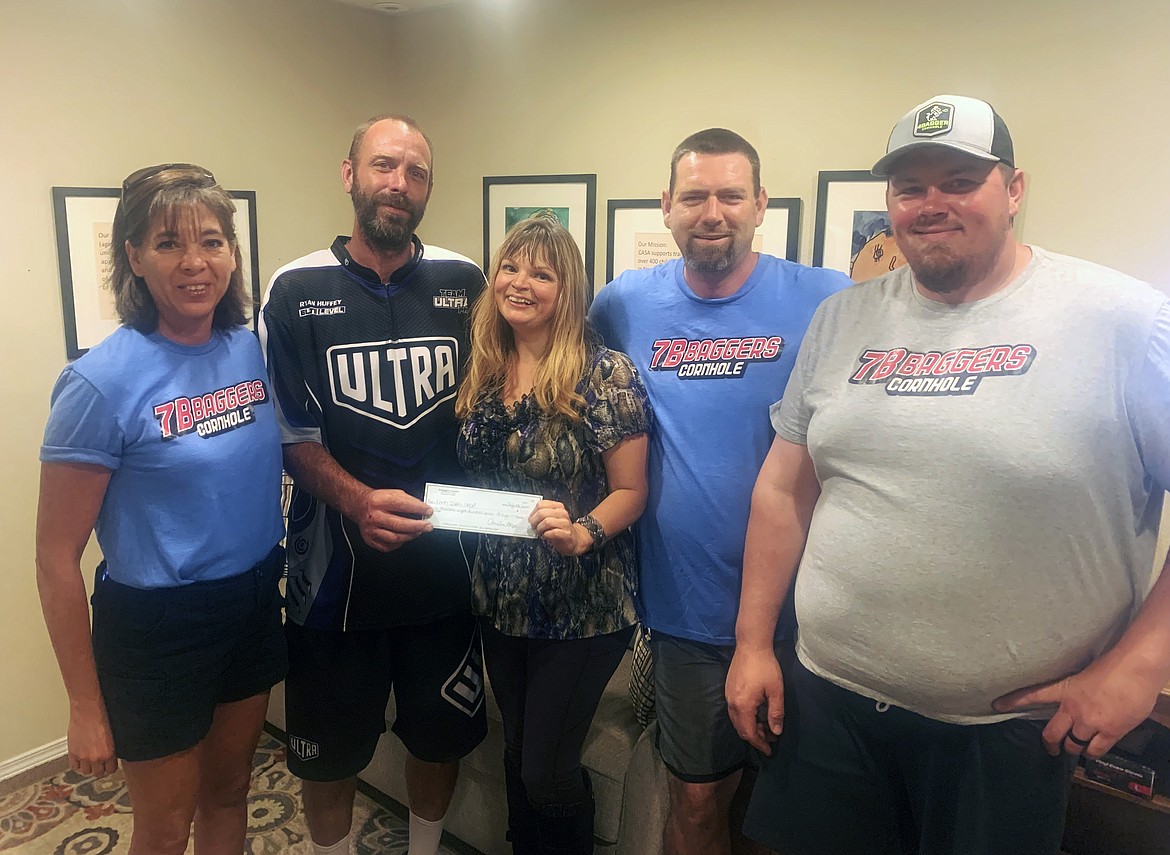 7B Baggers raised over $4,000 for child victims in Bonner County with club members recently donating the funds to North Idaho CASA. Pictured, from left, are Amelia Boyd, Pro Ryan Huffey, CASA Rural Supervisor, Jessie Sheldon, Justin Doty and Owen Rust.