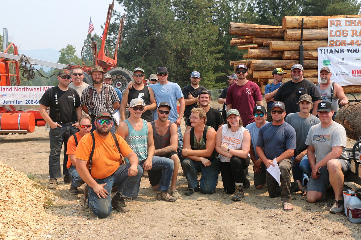 Timber Days competitors pose for a group photo prior to the start of the events.
