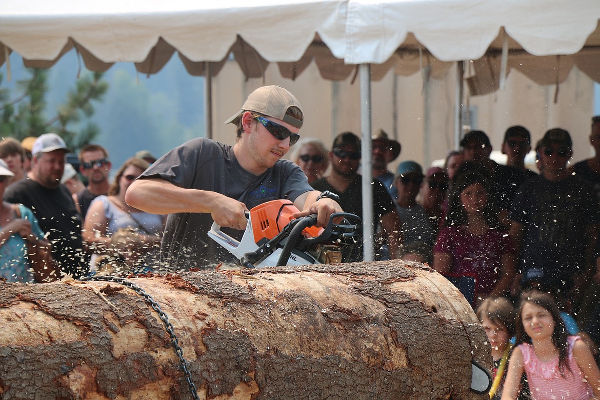 A competitor takes part in the Timber Days competitions on Saturday.
