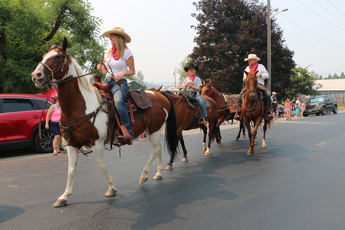 Members of the local backcountry horsemen's group ride in a Timber Days parade.