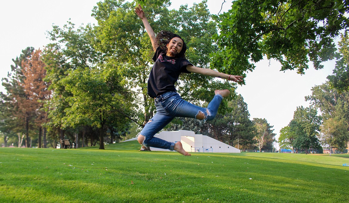 Darianna Vela shows off her dance moves with a stag leap at McCosh Park in Moses Lake Tuesday afternoon.