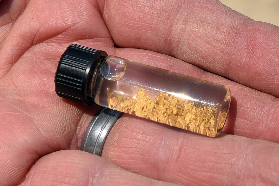 A vial of gold flakes represents a day's worth of work for the Northwest Montana Gold Prospectors at their claim along Libby Creek. (Jeremy Weber/Daily Inter Lake)