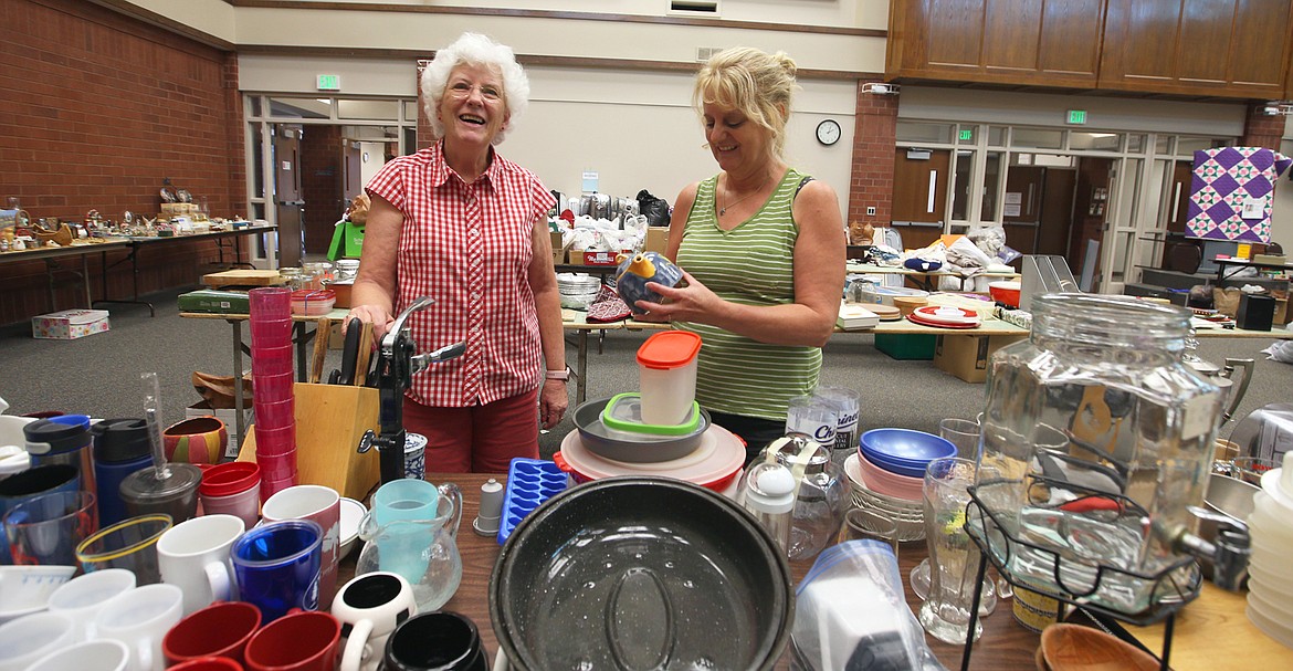 Karen Grindle, left, and Suzanne Zabriskie on Wednesday organize items donated for the big rummage sale at Community United Methodist Church.