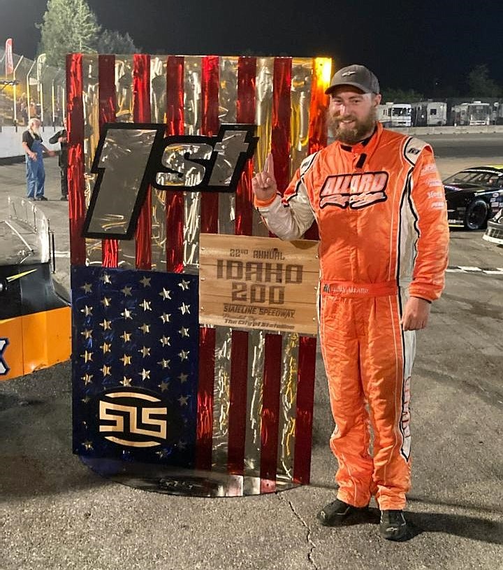 Corey Allard poses for a photo with the Idaho 200 first-place trophy on Saturday. The 2002 Sandpoint grad said he was almost speechless after the victory. "At first it was kind of hard to believe that finally things went our way and we earned it," he said.