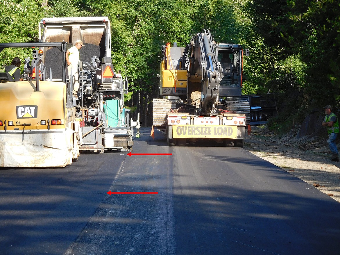 The innovative Thermoplastic markings which help identify the center line of Schweitzer Mountain Road begins during the paving process. A steamroller impresses four-by-six inch plates into the soft asphalt. The plates are removed, and then a couple days later, yellow reflective tape is melted into the divots.