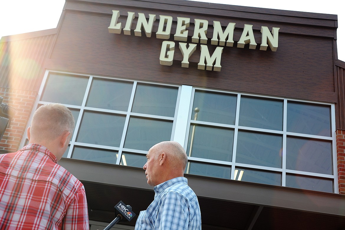 Montana Gov. Greg Gianforte gives an interview with a TV news station on Thursday, Aug. 5, 2021, at Linderman Elementary School in Polson, the site of a Red Cross shelter for people displaced by the nearby Boulder 2700 Fire.