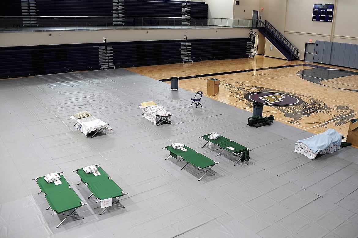 Cots are set up at a Red Cross shelter in the gymnasium of Linderman Elementary School in Polson for people displaced by the nearby Boulder 2700 Fire on Thursday, Aug. 5, 2021.