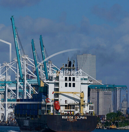 In this April 29, 2021 photo, The Warnow-Dolphin container ship enters PortMiami, in Miami Beach, Fla. Importers are contending with a perfect storm of supply trouble — rising prices, overwhelmed ports, a shortage of ships, trains, trucks — that is expected to last into 2022. (AP Photo/Marta Lavandier)