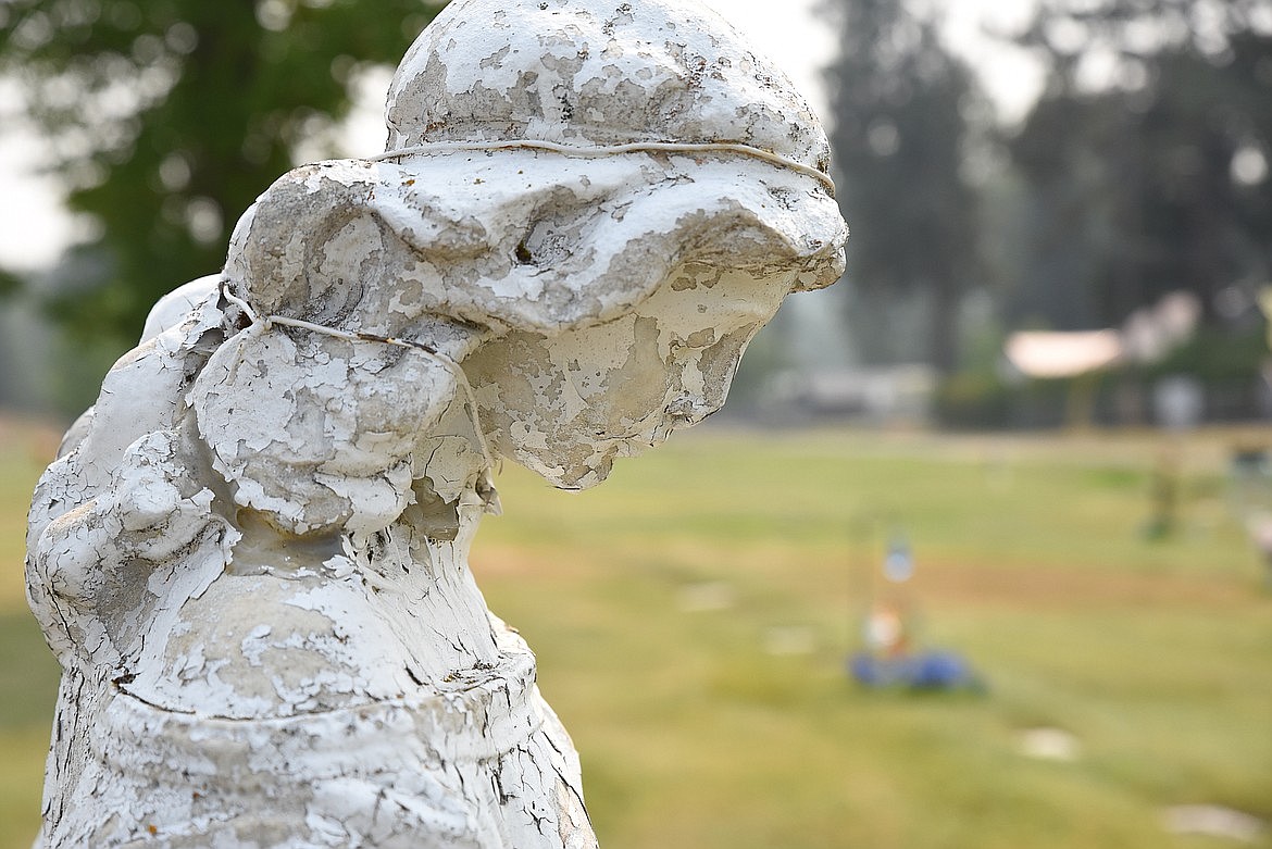 An unnamed statue of an angel looks over the veterans section of the city cemetery in Libby. American Legion Auxiliary No. 97 is raising money to restore the statue, first erected in 1922 to honor the region's World War I dead. (Derrick Perkins/Western News)