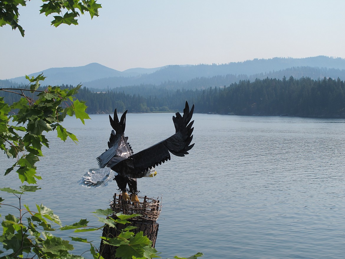 Eddie, a welded steel rod eagle with a 6.5 wingspan, overlooks Hayden Lake from a stump at the cabin of artist Byron Anderson. Photo courtesy of Byron Anderson.