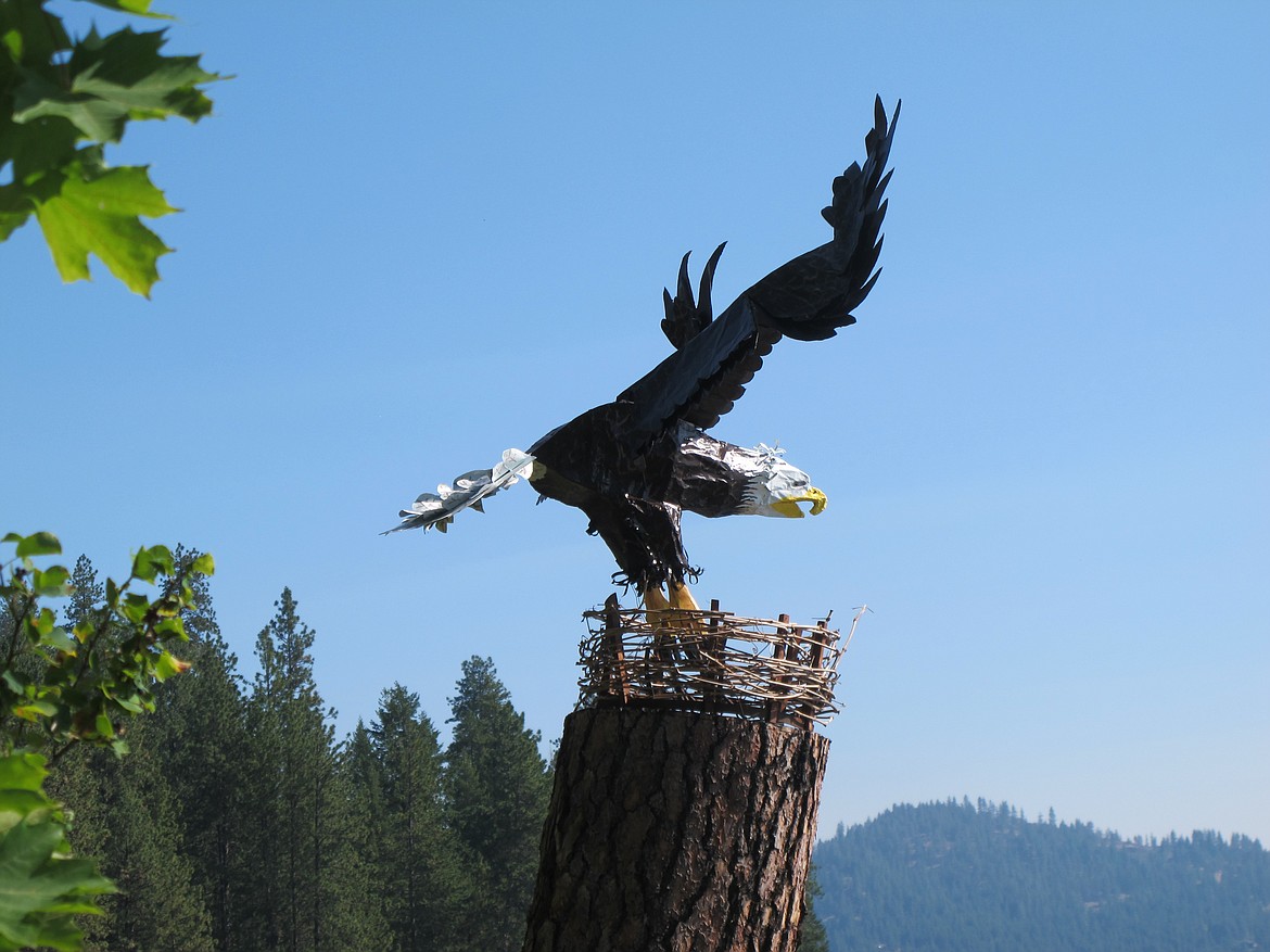 Eddie, a welded steel rod eagle created by Byron Anderson, perches on a 20-foot stump on the west side of Hayden Lake across from English Point. Photo courtesy of Byron Anderson.