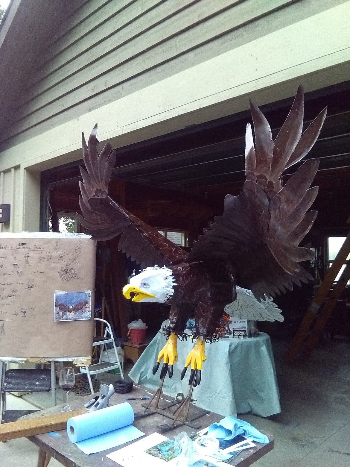 A newly assembled Eddie, a steel framed bald eagle, sits outside artist Byron Anderson's garage while Anderson prepares to attach the bird to it's post, a 20-foot stump overlooking Hayden Lake. Photo courtesy of Byron Anderson.