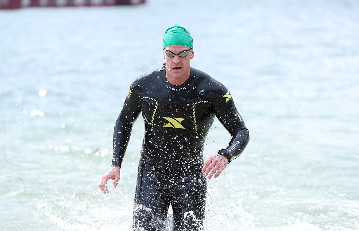 Adam Mayer rises out of the water and eyes the finish of the Long Bridge Swim on Saturday. He finished fifth overall.