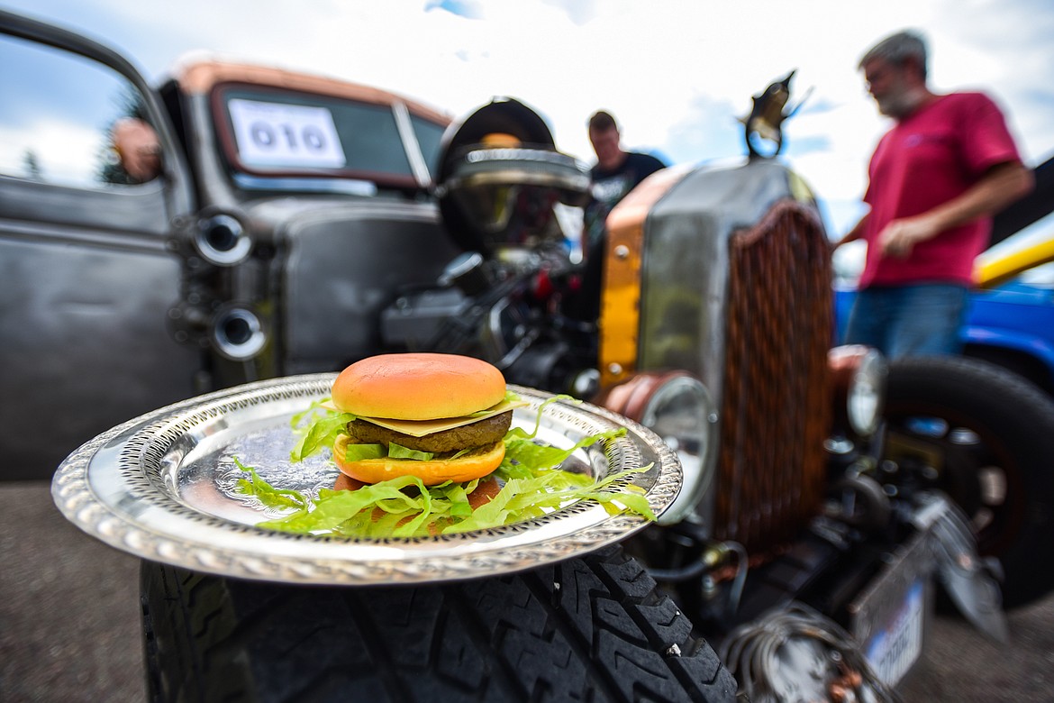 A decorative cheeseburger sits on the tire of Greg Greene's 1939 Chevy Rat Rod at the Evergreen Show 'N Shine at Conlin's Furniture on Saturday, Aug. 7. (Casey Kreider/Daily Inter Lake)