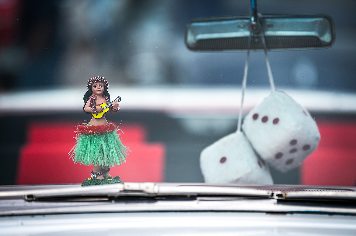 A hula dancer figurine and a pair of fuzzy dice inside a classic Chevy Bel Air at the Evergreen Show 'N Shine at Conlin's Furniture on Saturday, Aug. 7. (Casey Kreider/Daily Inter Lake)