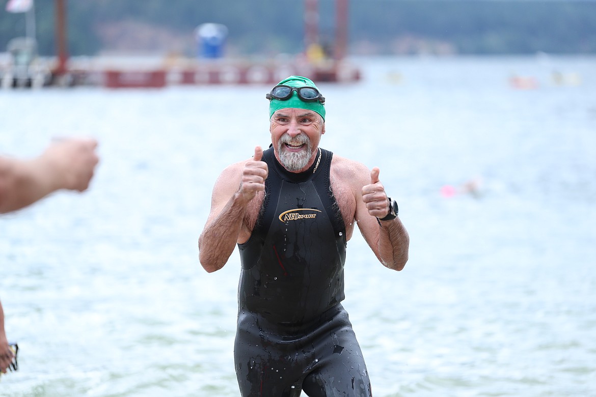 A swimmer celebrates as he crosses the finish line on Saturday.
