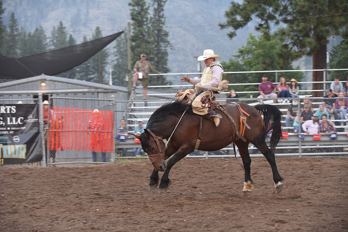 Dickinson’s Quint Stroh holds on during the saddle bronc riding event last Friday at the Mineral County Fair Superior Lions Club “Go for The Gold” Rodeo. (Scott Shindledecker/Mineral Independent)