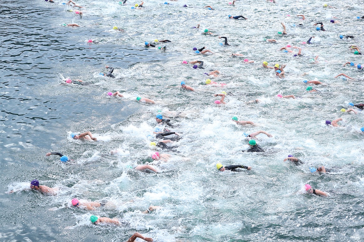 Swimmers start the 26th annual Long Bridge Swim on Saturday.