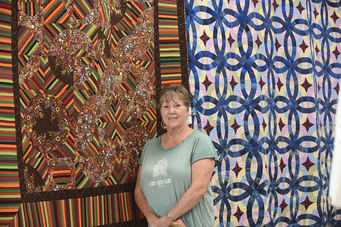 Della Russell, of St. Regis, shows off “Ugly Betty,” a quilt she made and displayed at the 20th Annual Cabin Fever Quilters Show last weekend at the Mineral County Fair in Superior. (Scott Shindledecker/Mineral Independent)