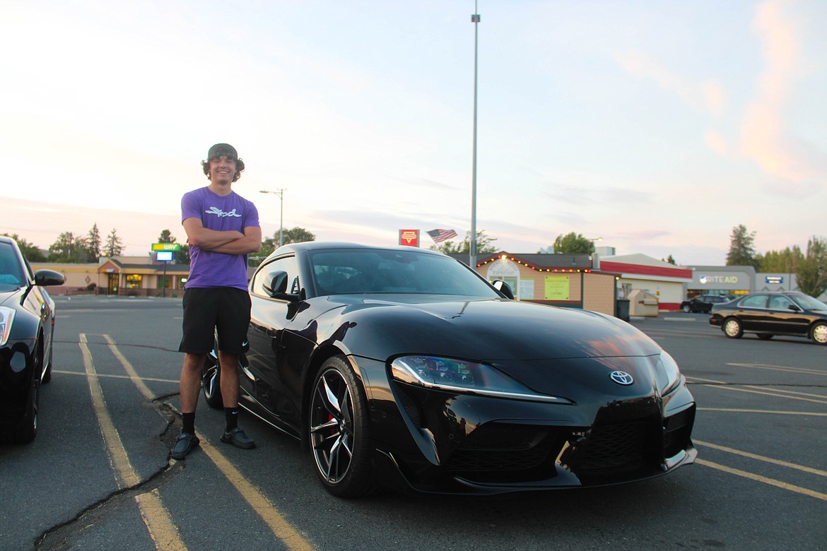 Moses Lake resident Jayce Moore stands next to his brand new Toyota Supra on Saturday.