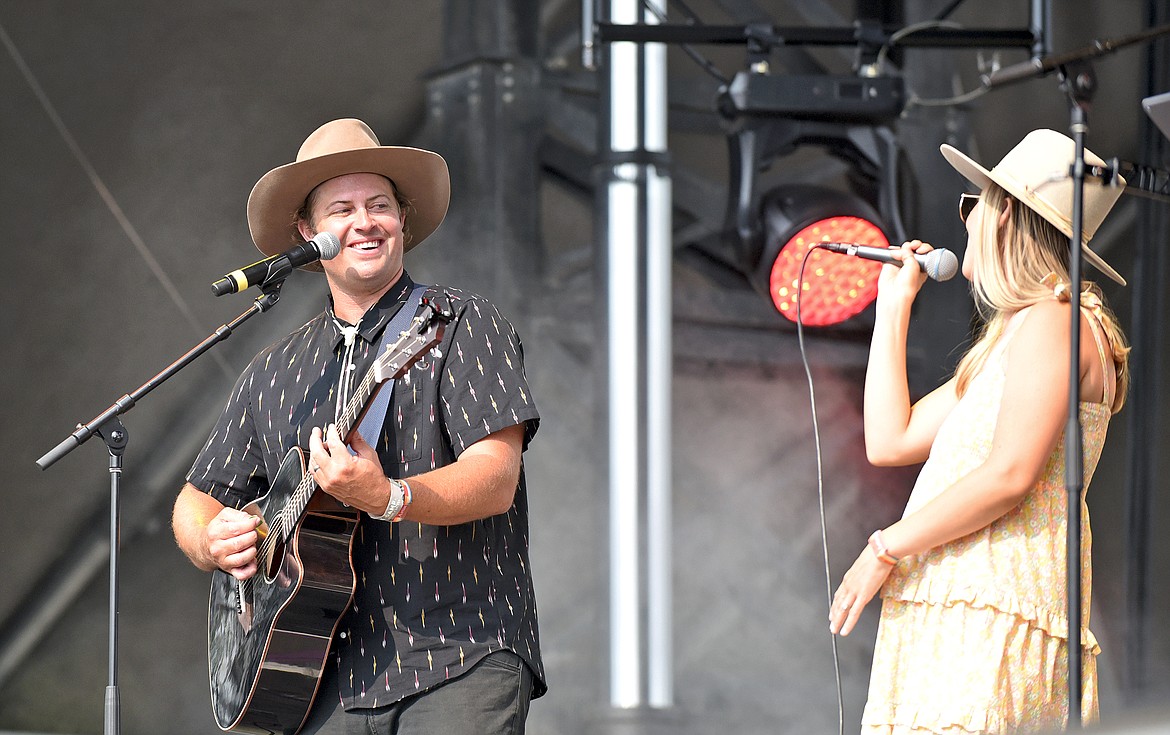 Kyle Archer smiles at his wife Natalie while their band Archertown performs at the Under the Big Sky Festival in Whitefish in July. (Whitney England/Whitefish Pilot)