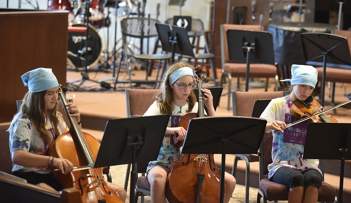 Lilly Mollenkopf, Lillian Nelson, and Cassidy Krack perform as part of an ensemble Friday during the Camp Festival Amadeus concert at Christ Lutheran Church. (Heidi Desch/Whitefish Pilot)