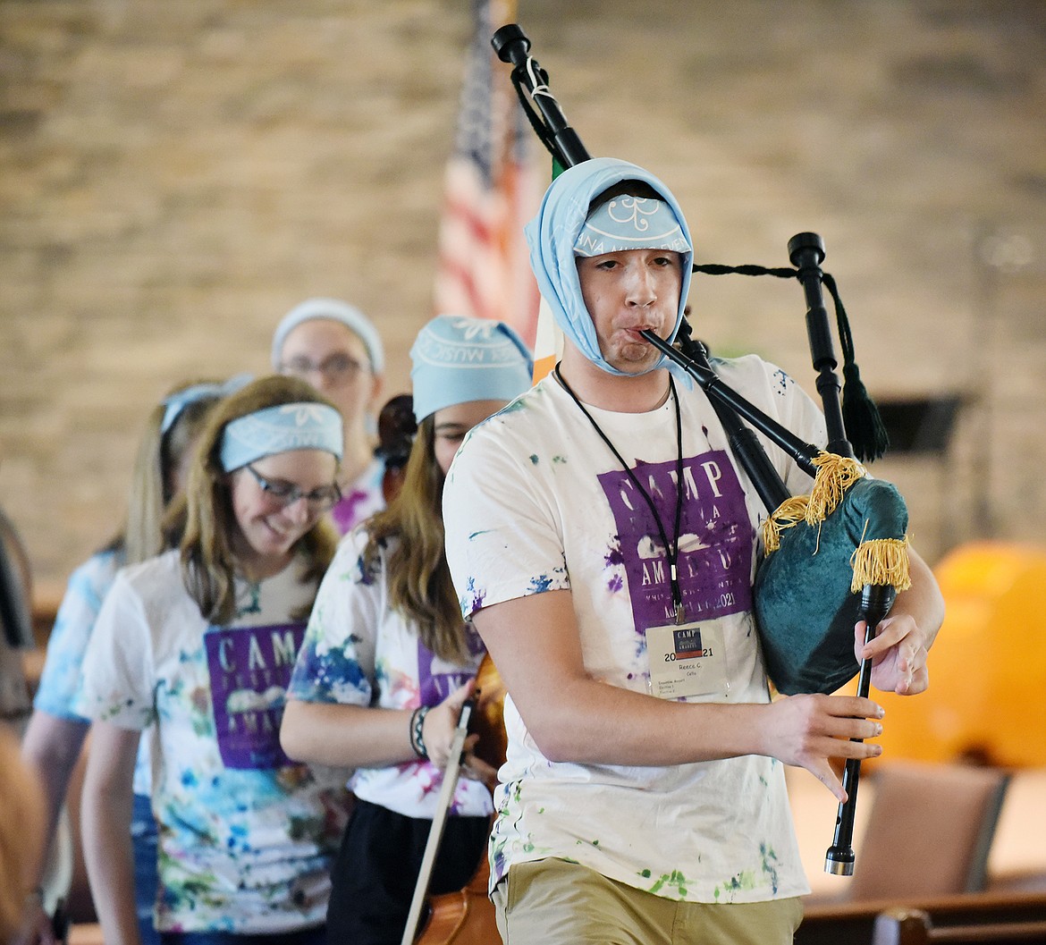 Reece Connors plays the bagpipe while leading the C-String Cloggers Ensemble Friday during the Camp Festival Amadeus concert at Christ Lutheran Church. Camp Festival Amadeus is a chamber orchestra music camp for intermediate and advanced string students in seventh through 12th grades. The camp is held in conjunction with Glacier Symphony & Chorale’s Festival Amadeus. (Heidi Desch/Whitefish Pilot)