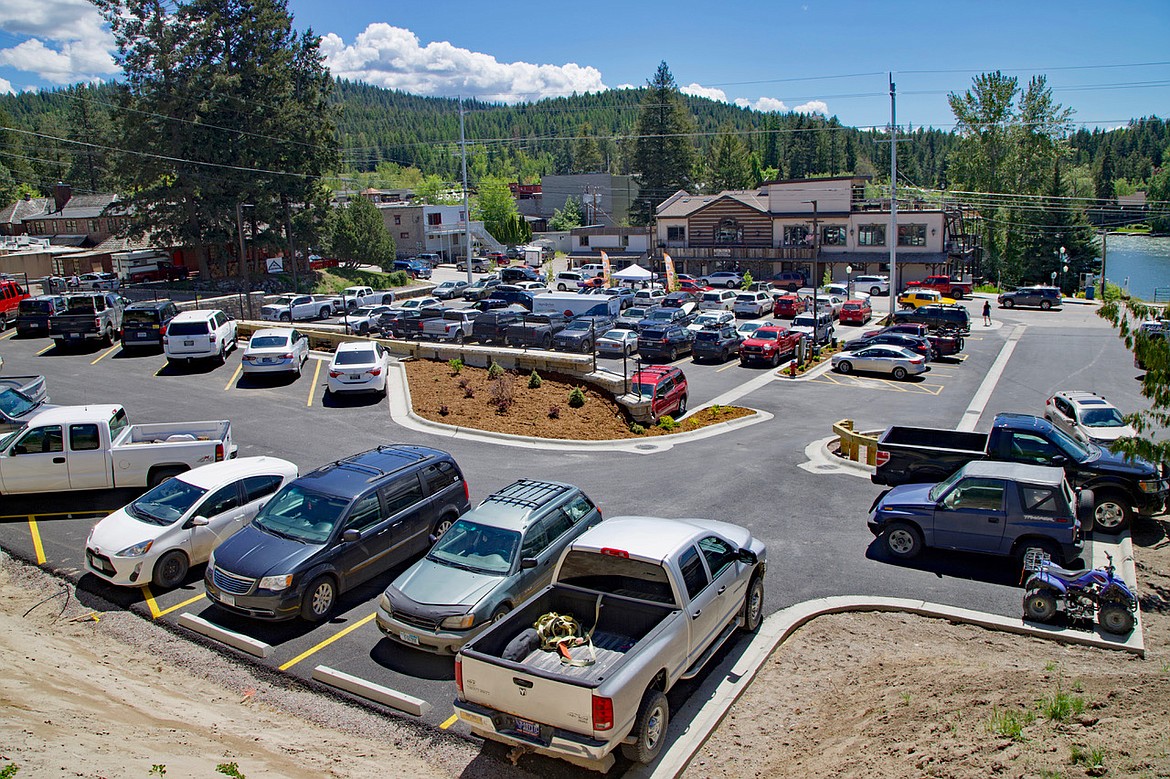 The new parking lot on Grand Avenue in Bigfork is filled with cars as the summer season began. (Kay Bjork photo)