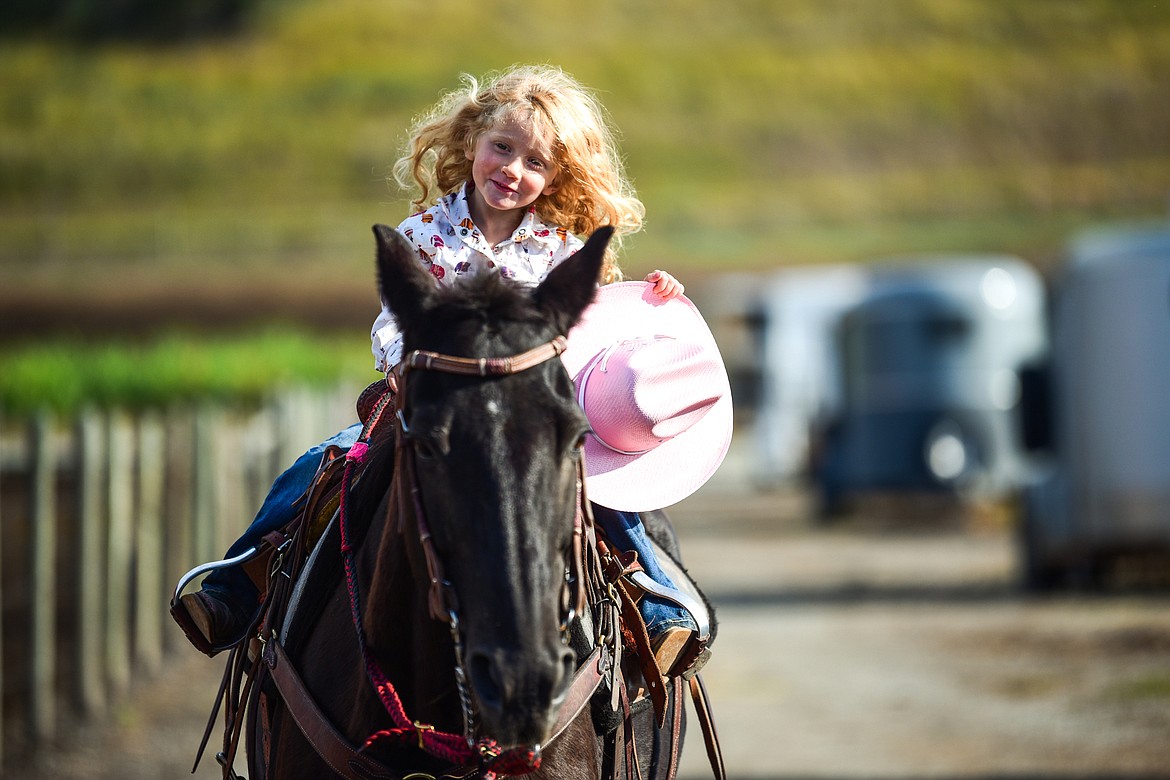 Ember McLean, 3, rides her horse Beni at Ranch 'M near Kalispell on Tuesday, Aug. 10, 2021. Beni is the mother of Daisy, the horse belonging to Ember's mother Stephanie. (Casey Kreider/Daily Inter Lake)