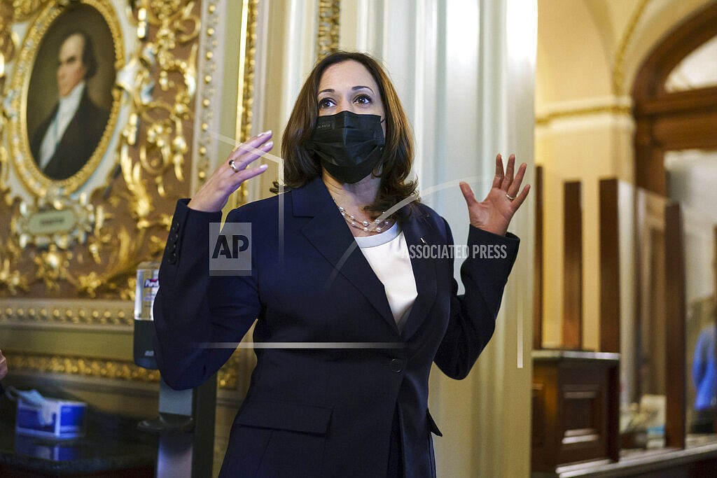 Vice President Kamala Harris arrives at the Senate as a coalition of Democrats and Republicans approve the $1 trillion bipartisan infrastructure package to deliver a cornerstone of President Joe Biden's agenda, at the Capitol in Washington, Tuesday, Aug. 10, 2021. (AP Photo/J. Scott Applewhite)