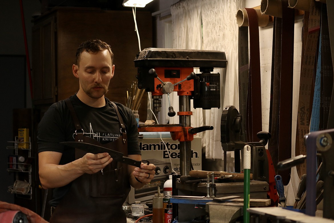 Andrew Hall, owner of Flatline Knives, recently won first place in the competition TV series "Forged by Fire," episode "Barrel Full of Mystery" that aired July 14. Hall does all his work out of his garage workshop in his Coeur d'Alene home. HANNAH NEFF/Press