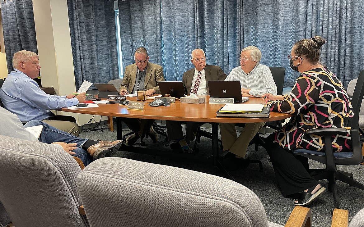 Port of Moses Lake Executive Director Don Kersey, along with commissioners Darrin Jackson, David “Kent” Jones and Stroud Kunkle and executive assistant Bonnie Peterson meet on Monday to consider the assessment roll for the port’s West Side Employment Center Local Improvement District tax roll.