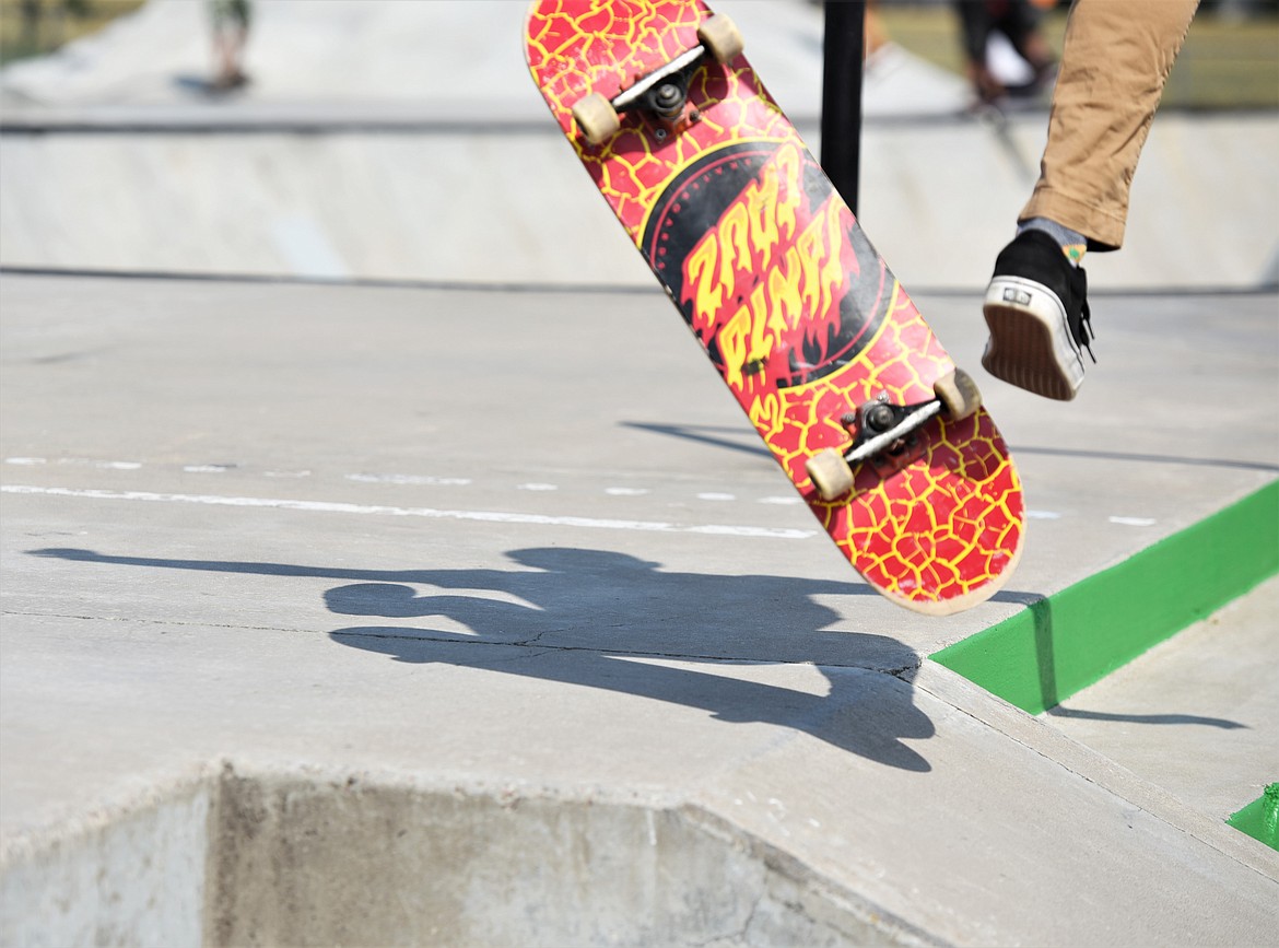 A skater flips his board mid-air. (Scot Heisel/Lake County Leader)