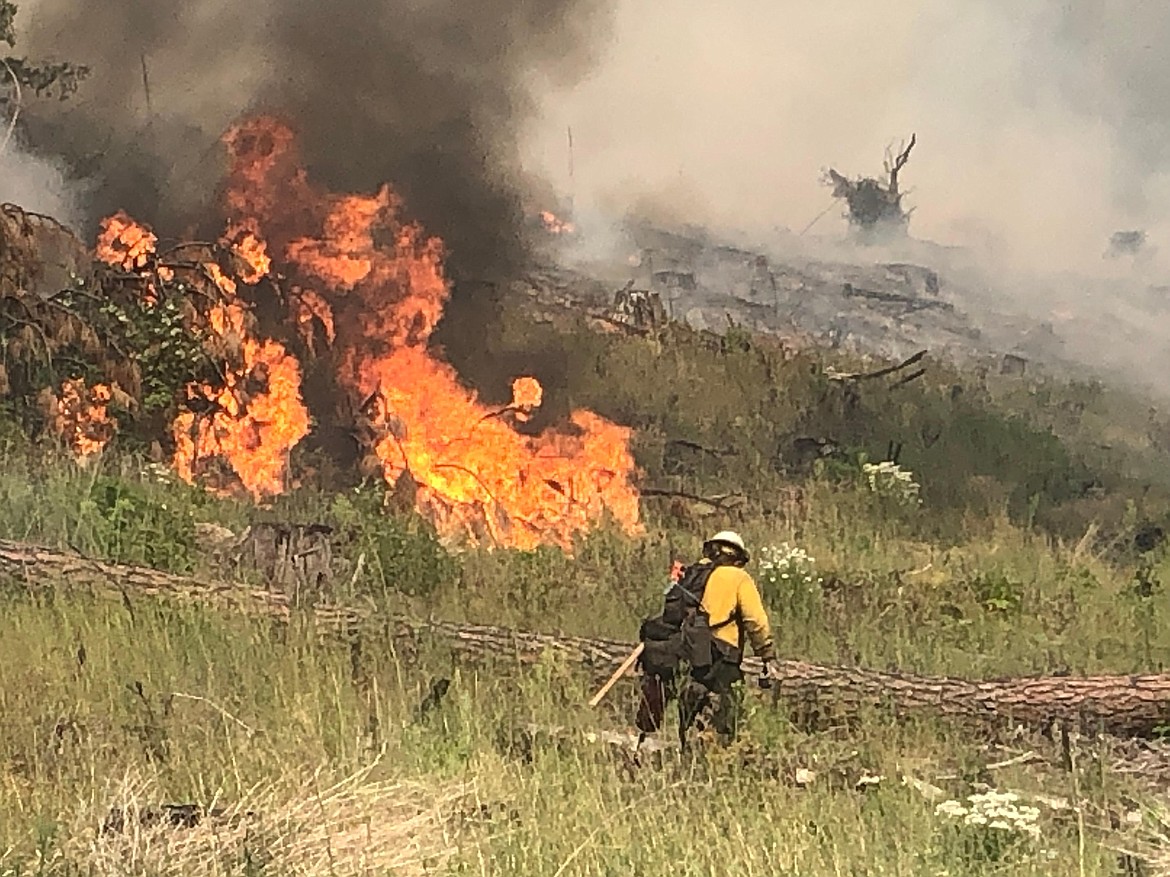 A July 26 photo of fire personnel fighting the South Yaak fire near Troy Mont. The South Yaak fire is 44% contained, and has burned 10,388-acres.