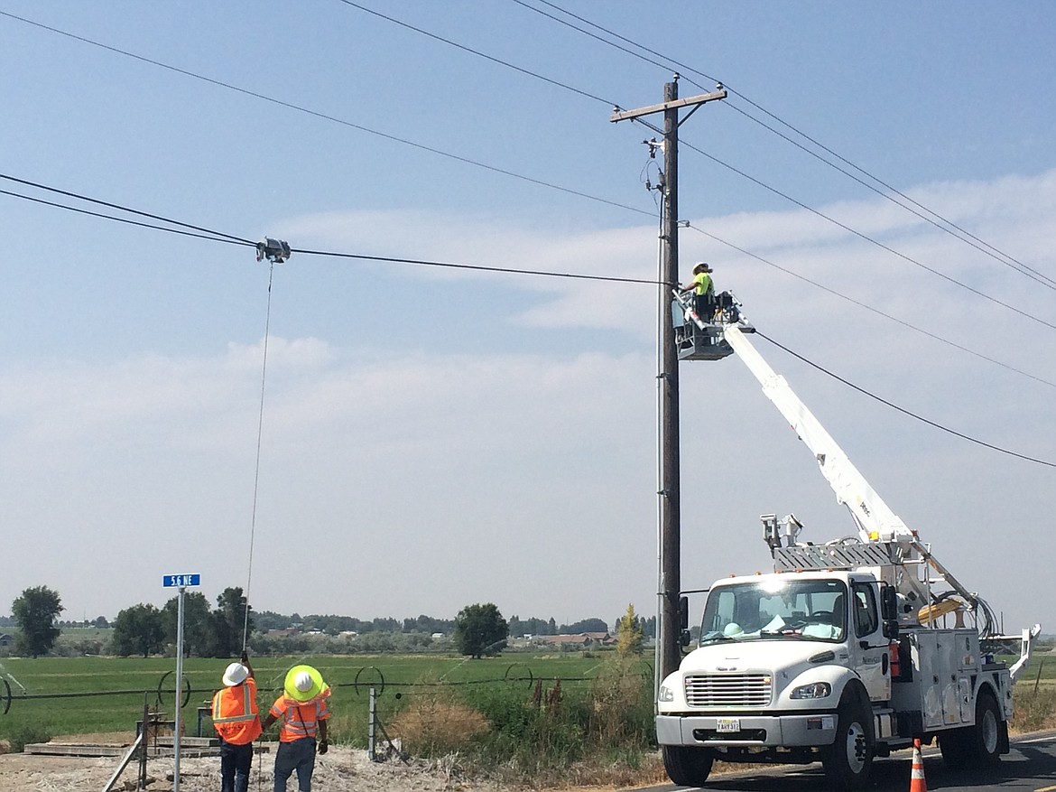 Grant County PUD contractors install fiber-optic line north of Moses Lake last year.