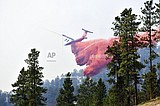 Wildfire bears down on Montana towns as West burns