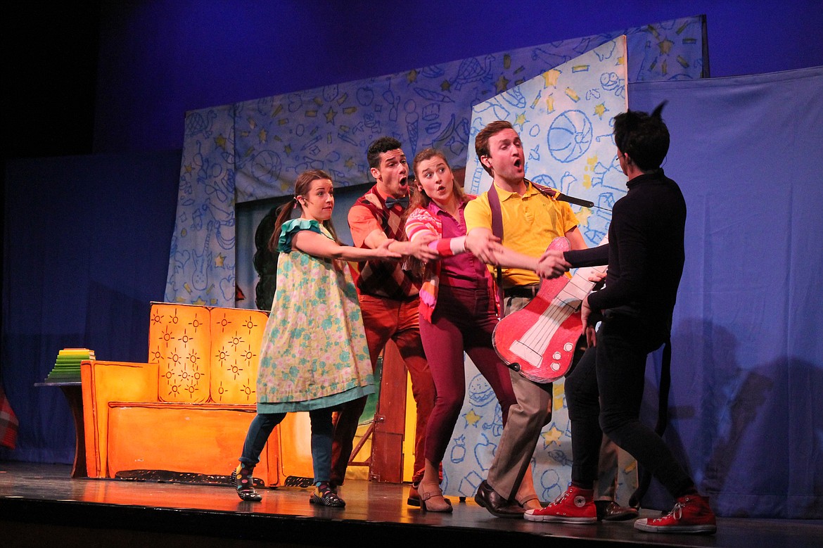 Pete (Mike Dorsey, left) teaches the Biddle family to jam at a 2018 production of “Pete the Cat,” sponsored by Columbia Basin Allied Arts.