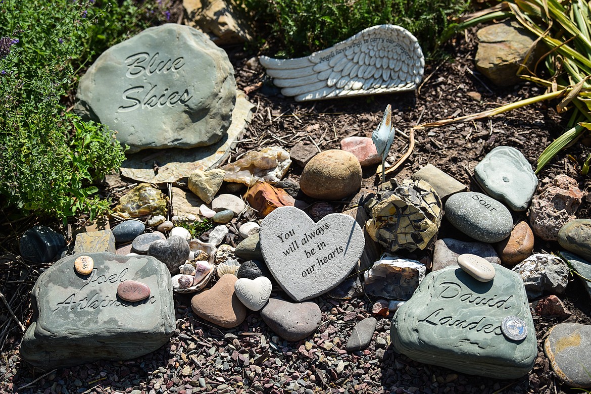 Inscribed rocks from the North Fork of the Flathead River decorate the memory garden at Skydive Lost Prairie near Marion. Some of the rocks include names of people who perished in a plane crash in 2007. (Casey Kreider/Daily Inter Lake)
