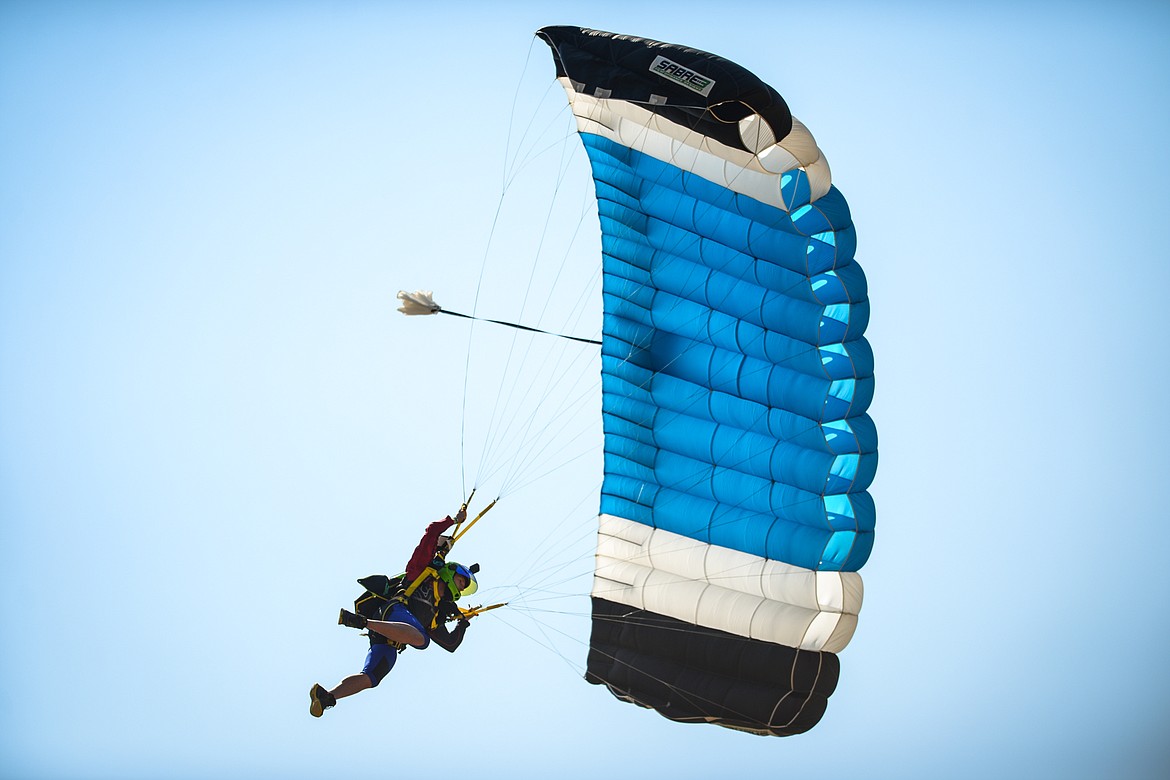 A skydiver swoops in for a landing at the 2021 Skydive Lost Prairie Boogie at Meadow Peak Skydiving near Marion on Thursday, Aug. 12, 2021. (Casey Kreider/Daily Inter Lake)