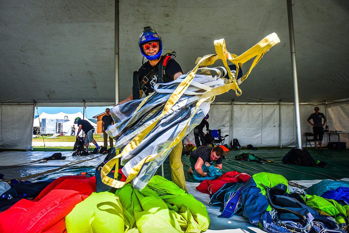 A skydiver lays out his parachute to begin the packing process at the 2021 Skydive Lost Prairie Boogie at Meadow Peak Skydiving near Marion on Thursday, Aug. 12, 2021. (Casey Kreider/Daily Inter Lake)