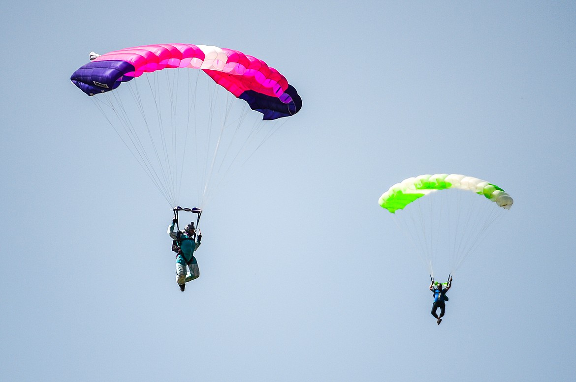 Skydivers descend over the 2021 Skydive Lost Prairie Boogie at Meadow Peak Skydiving near Marion on Thursday, Aug. 12, 2021. (Casey Kreider/Daily Inter Lake)
