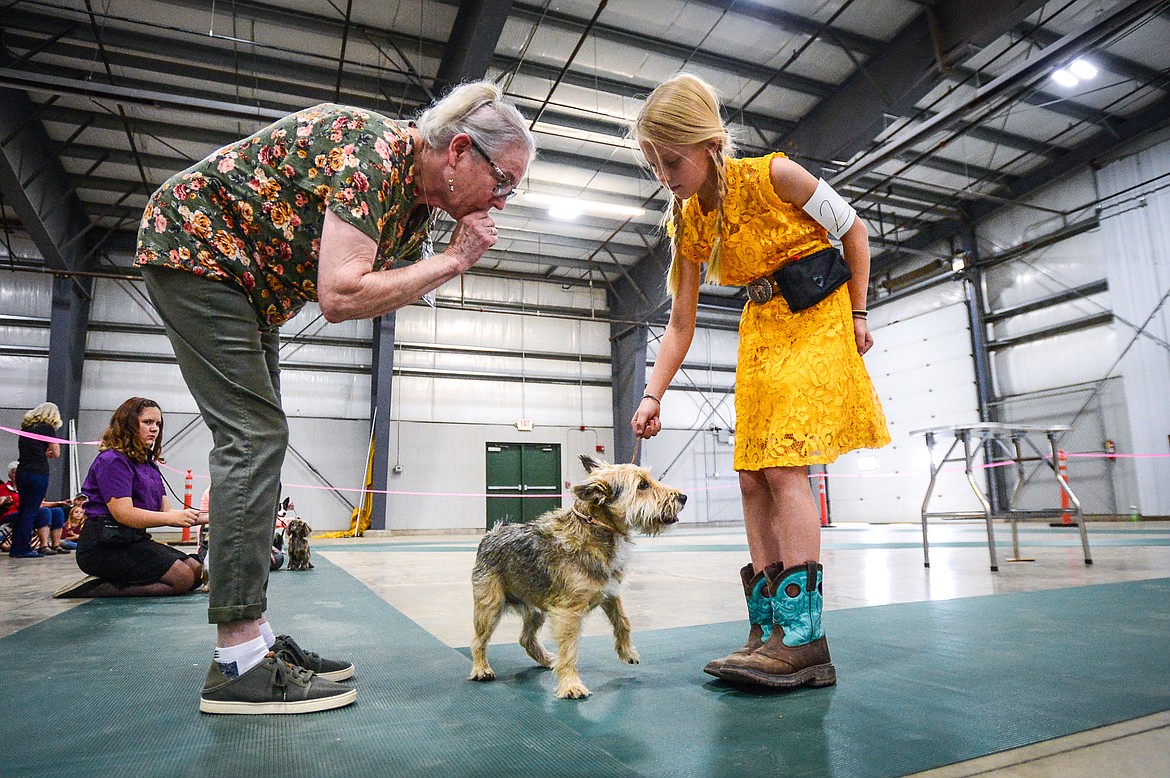 Judge Marney McLeary, left, gets a closer look at Lilly Hornbrook's Jack Russell terrier mix named Ruger at the 4-H Dog Show at the Northwest Montana Fair on Friday, Aug. 13. (Casey Kreider/Daily Inter Lake)