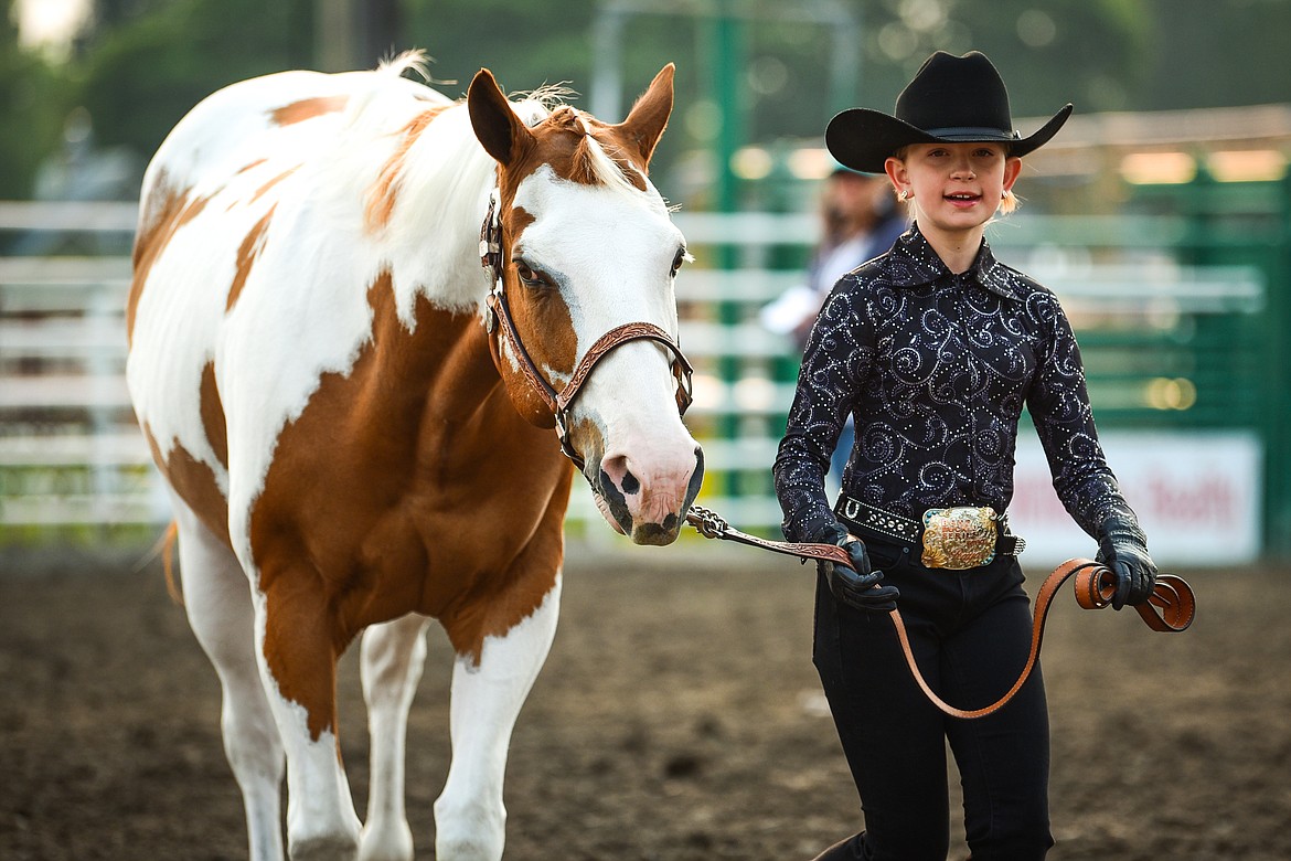 Raya Gronley leads her horse Harry through the pattern in pre-junior level Showmanship at the 4-H Horse Show at the Northwest Montana Fair on Saturday, Aug. 14. (Casey Kreider/Daily Inter Lake)