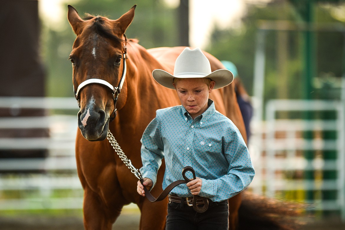 Kiel Guffin leads his horse Ivy through the pattern during pre-junior level Showmanship at the 4-H Horse Show at the Northwest Montana Fair on Saturday, Aug. 14. (Casey Kreider/Daily Inter Lake)